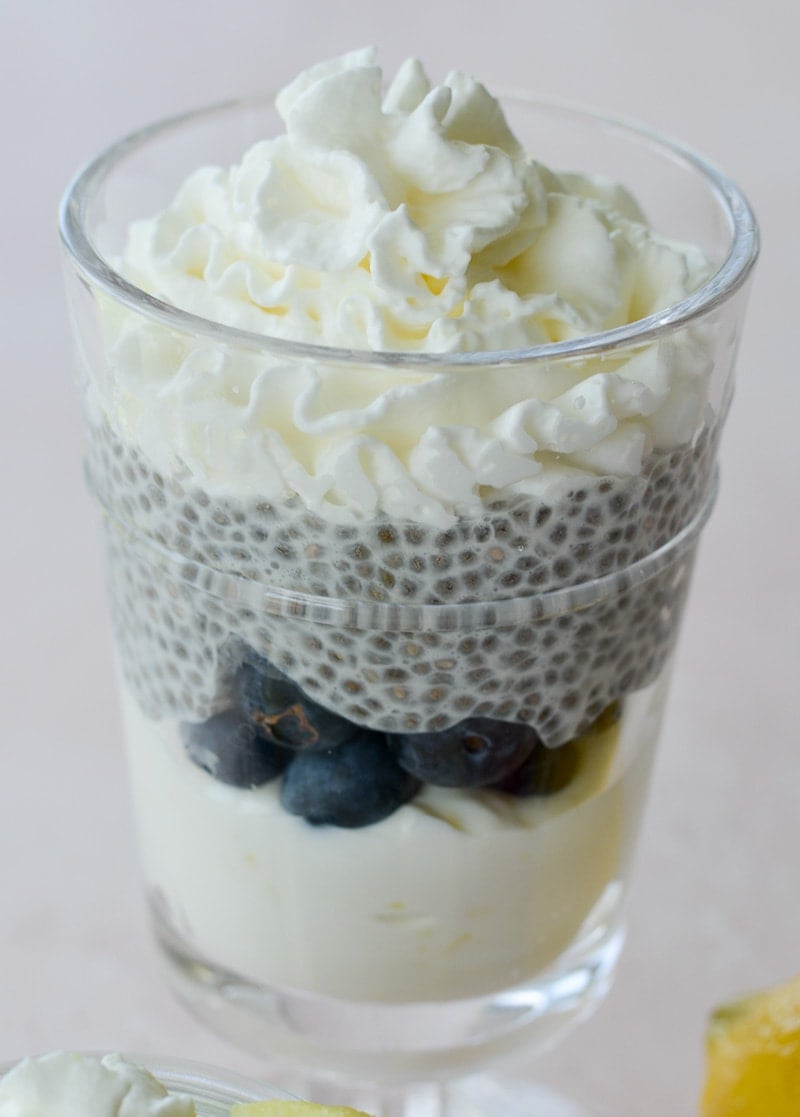 These Keto Lemon Cheesecake Parfaits feature a creamy lemon cheesecake layer topped with vanilla chia seed pudding! An easy no bake keto treat!